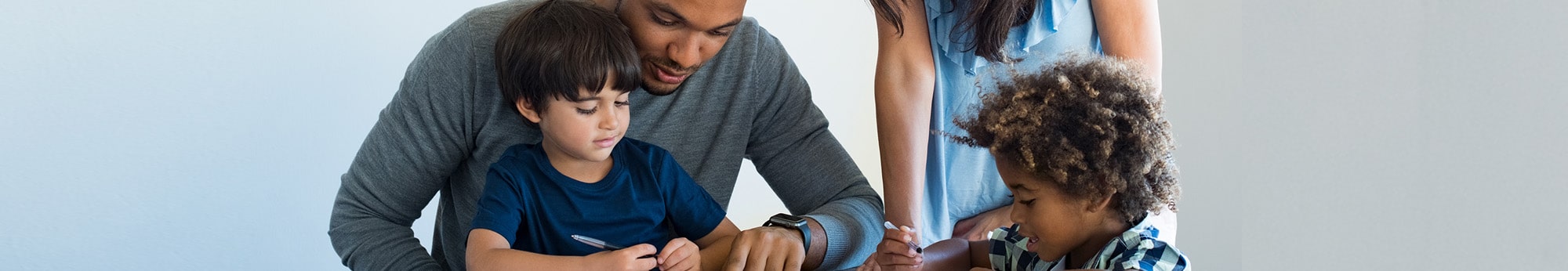 parents helping their children with homework