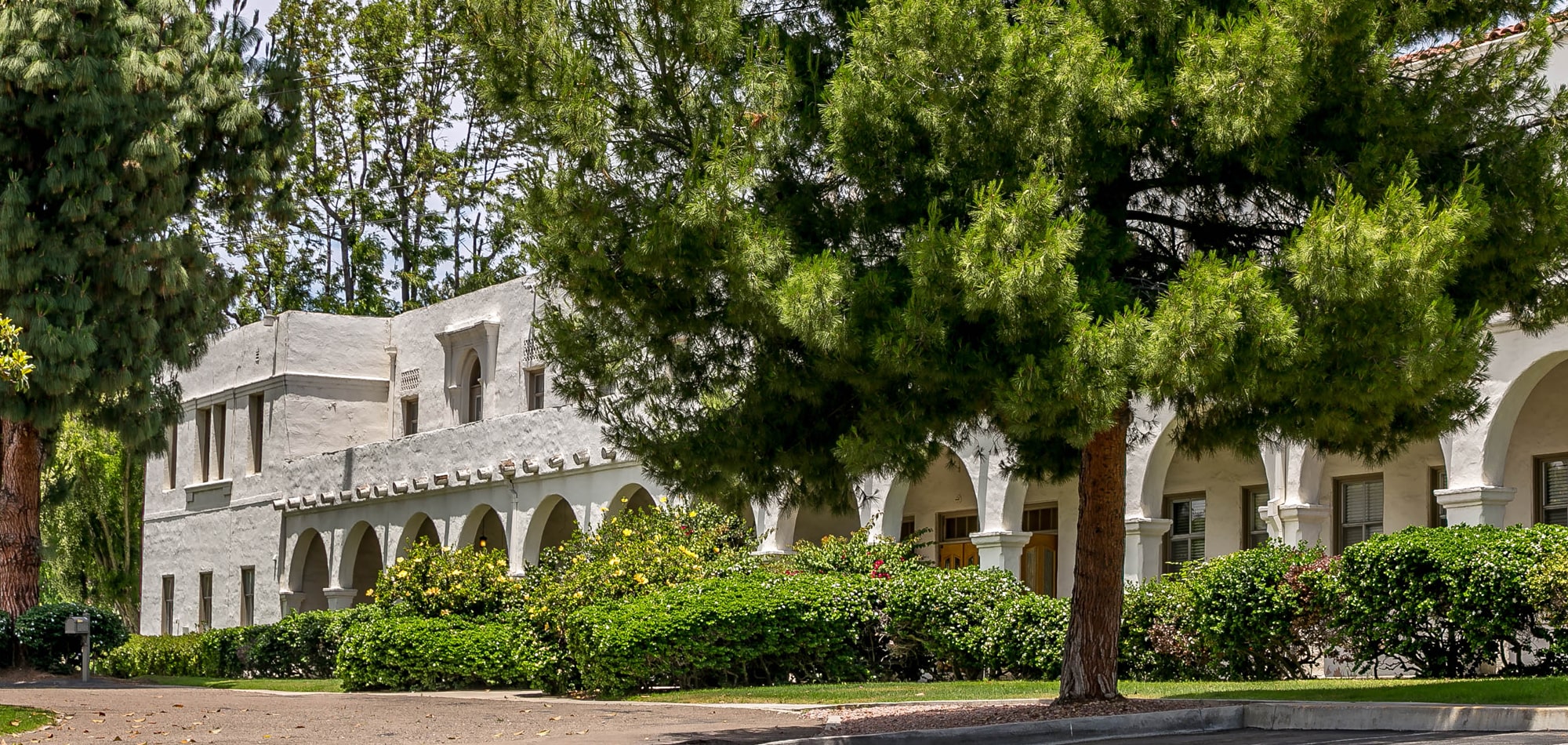 side view of Nazareth School building with tree in front