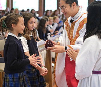 priest with two students