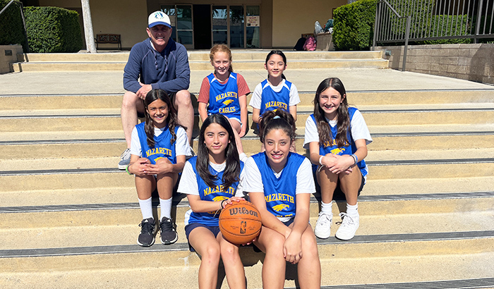 Girls basketball team on school stairs