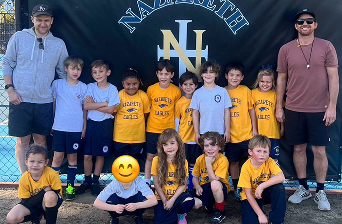 Young athletes dressed in yellow and blue uniforms and their coaches