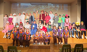 Cast of Willy Wonka Jr. on stage