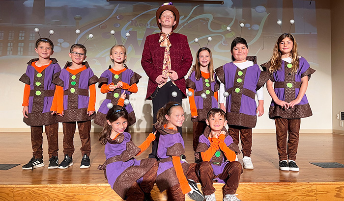 Willy Wonka Jr. cast members on stage