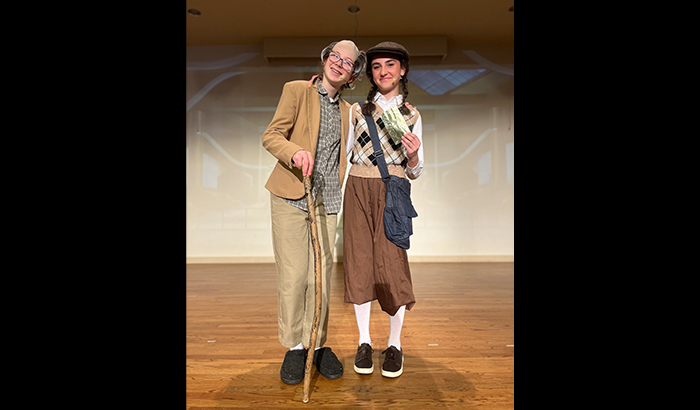 Two happy student actors on stage