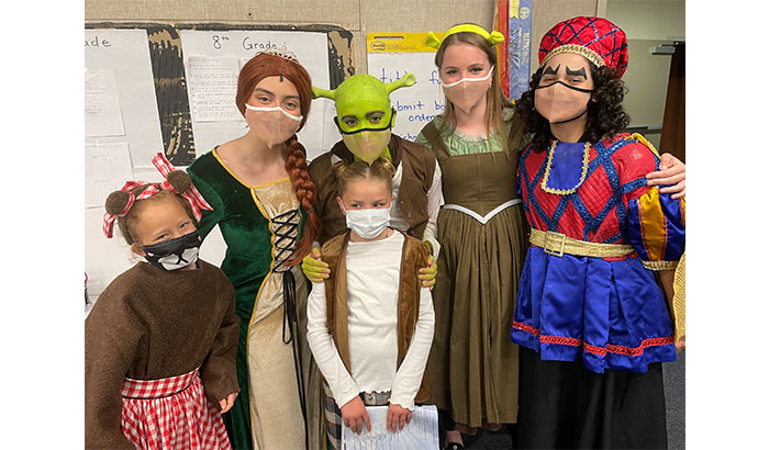Shrek the Musical cast posing with other students