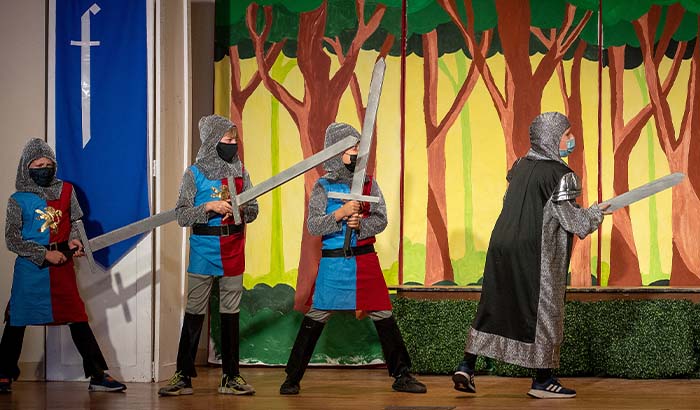 Students dressed as knights fighting